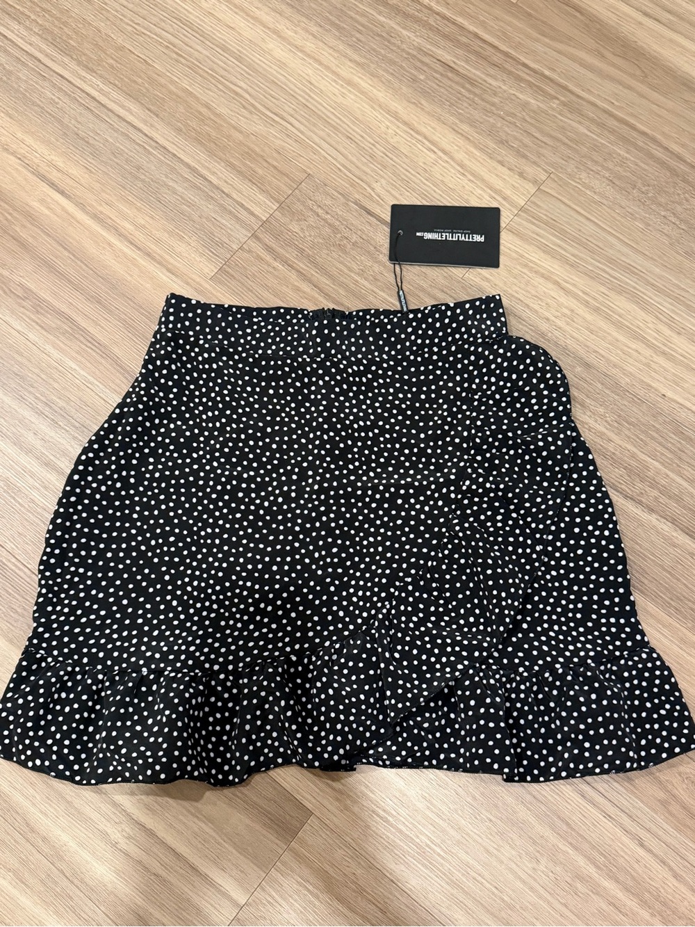NWT PrettyLittleThing Black and White Polka Dot Ruffle Hem Mini Skirt